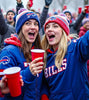 Buffalo Bills game day tailgating in the parking lot with friends and drinks during the winter season.