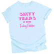60 Years of Being Fucking Fabulous women’s birthday t-shirt in blue, layered pink fonts in three playful styles, fun and cheeky 60th birthday graphic tee
