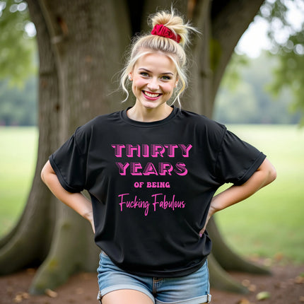 Woman wearing ‘30 Years of Being Fucking Fabulous’ black birthday t-shirt, bold pink mixed-font lettering, confident and playful 30th birthday celebration vibe.