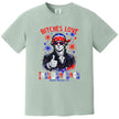 Bold Independence Day graphic tee in green featuring ‘Bitches Love Independence’ with Thomas Jefferson, sunglasses, bandana, and sparkles