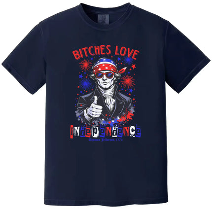 Bitches Love Independence’ patriotic t-shirt in navy, Jefferson graphic with sunglasses, thumbs up, and fireworks, bold Independence Day design