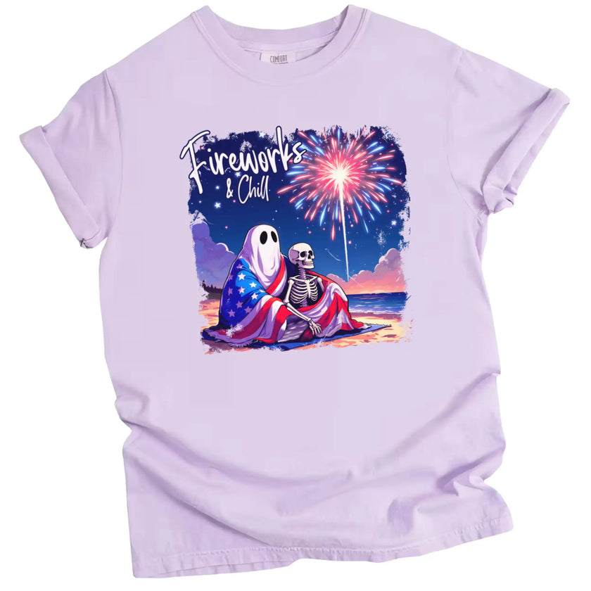 Fireworks and Chill patriotic t-shirt in purple, ghost and skeleton couple under flag blanket watching fireworks at night, cozy and cute July 4th graphic tee.