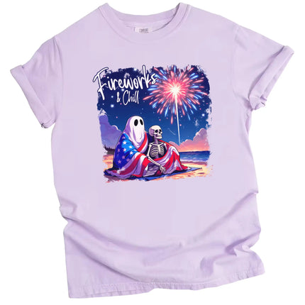 Fireworks and Chill patriotic t-shirt in purple, ghost and skeleton couple under flag blanket watching fireworks at night, cozy and cute July 4th graphic tee.