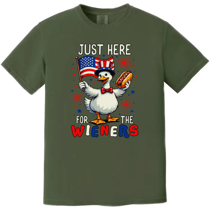 Funny patriotic goose t-shirt in green, holding flag and hot dog, ‘Just Here for the Wieners’ design for July 4th cookouts.