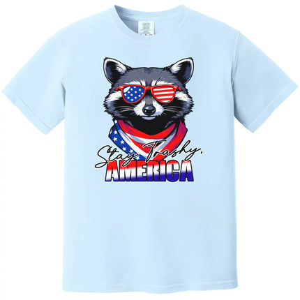 Patriotic raccoon graphic tee in light blue, ‘Stay Trashy America’ design with sunglasses and bandana, fun Independence Day shirt.