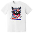 Male model wearing white ‘Stay Trashy America’ t-shirt outdoors, raccoon with sunglasses and bandana graphic, funny July 4th party vibe.