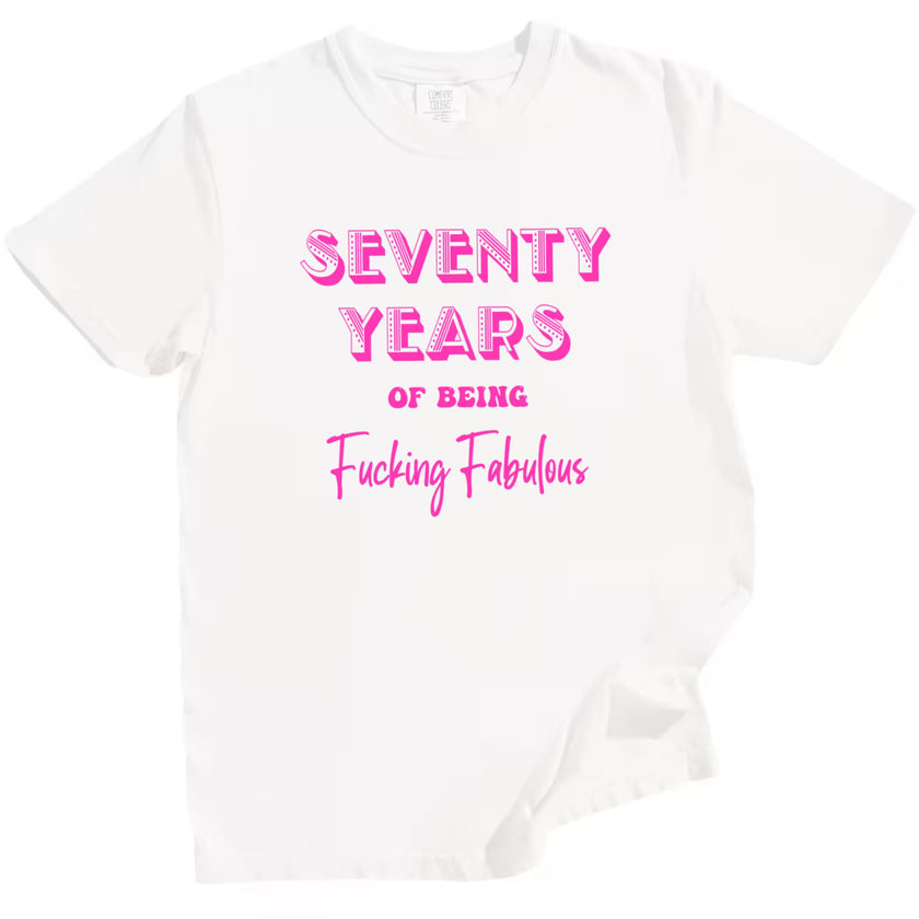 70 Years of Being Fucking Fabulous women’s birthday t-shirt in white, bright pink mixed-font lettering, playful milestone 70th birthday graphic tee for women.