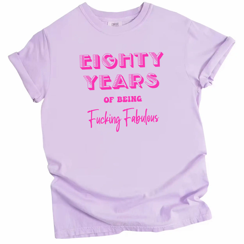 80 Years of Being Fucking Fabulous women’s birthday t-shirt in purple, layered pink mixed-font lettering, fun and cheeky milestone 80th birthday graphic tee