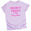 90 Years of Being Fucking Fabulous women’s birthday t-shirt in purple, layered pink mixed-font lettering, fun and cheeky milestone 90th birthday graphic tee