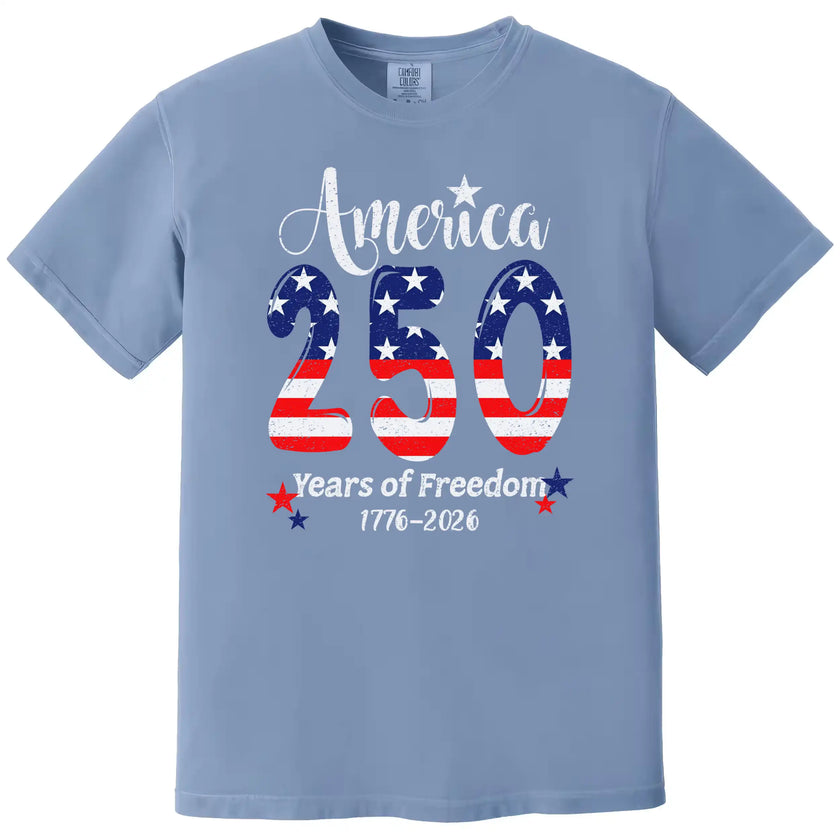 America 250 years of freedom t-shirt in light blue, large 250 American flag design with star sparkles and elegant patriotic lettering.