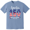 America 250 years of freedom t-shirt in light blue, large 250 American flag design with star sparkles and elegant patriotic lettering.