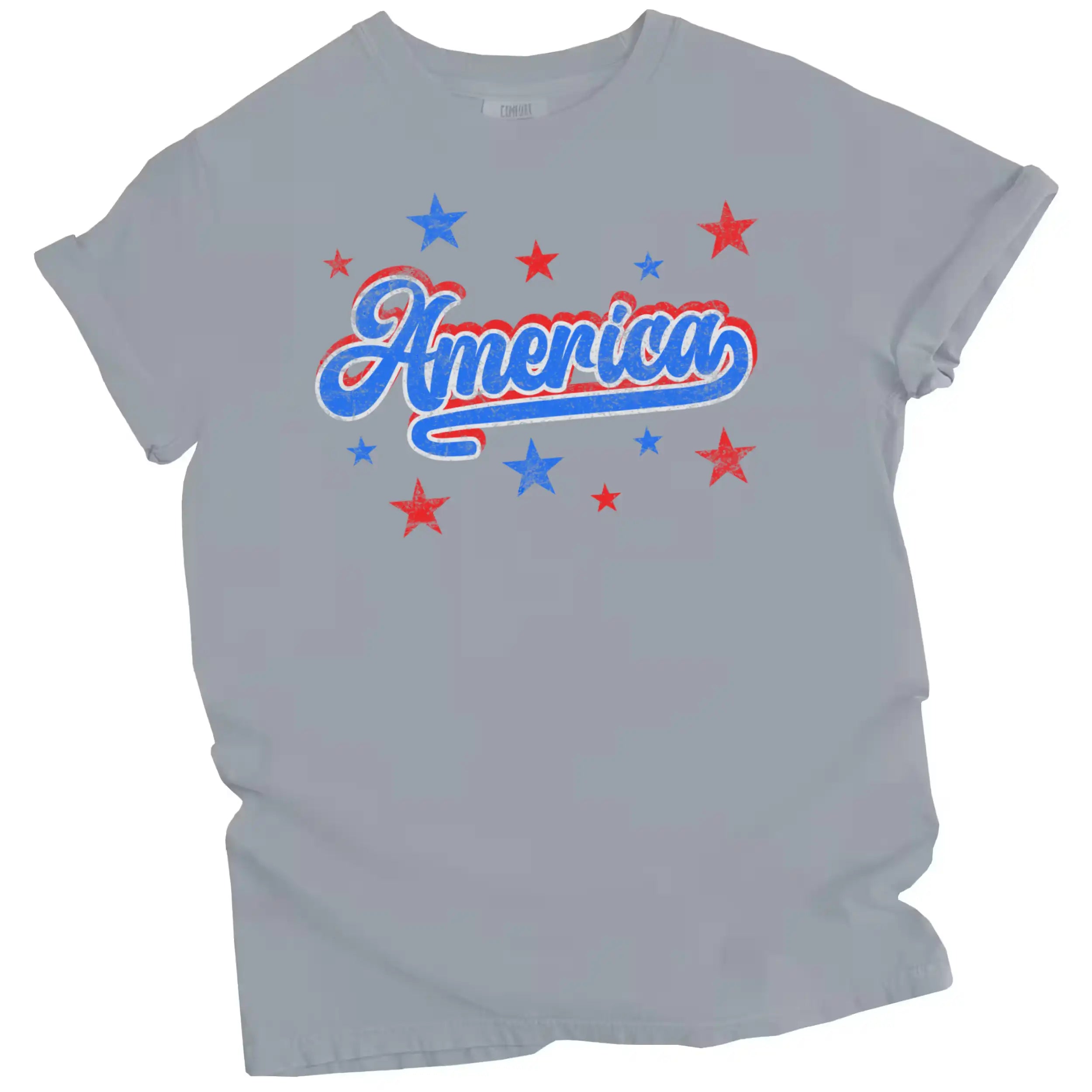 Vintage ‘America’ t-shirt in grey, distressed lettering with red white blue colorblock outline and star sparkles, retro patriotic graphic tee.