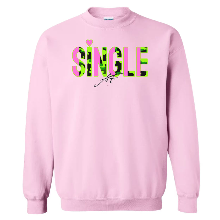 Light pink “Single AF” sweatshirt flat laid with sleeves spread on white background, showing full design