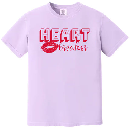 Retro heartbreaker graphic tee with bold red lettering, purple shirt flat lay on white background, fun romantic style for Valentine’s Day wear
