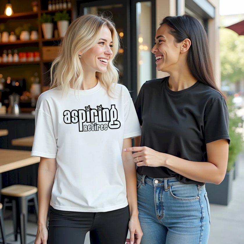 Woman wearing an “Aspiring Retiree” retro graphic t-shirt in a casual outdoor café setting with a friendly social reaction and smile from a passerby woman.