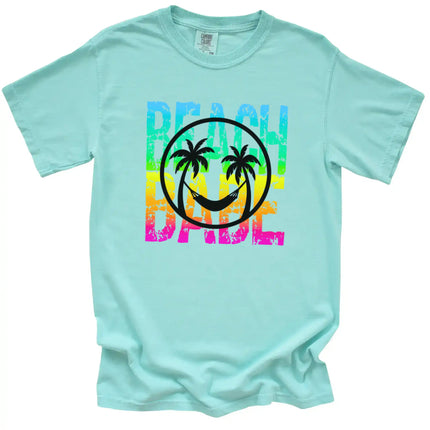 Summer Beach Babe tee in mint, neon rainbow distressed text with palm tree smile face and hammock design, tropical vacation shirt.