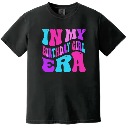 In My Birthday Girl Era women’s birthday tee in black, big retro pink, purple, and blue lettering, playful graphic shirt perfect for birthday celebrations.