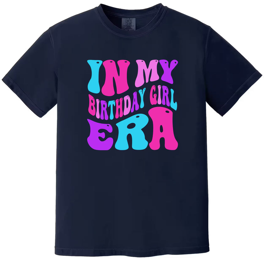 In My Birthday Girl Era women’s birthday tee in navy, big retro pink, purple, and blue letters, colorful and playful graphic birthday t-shirt for women