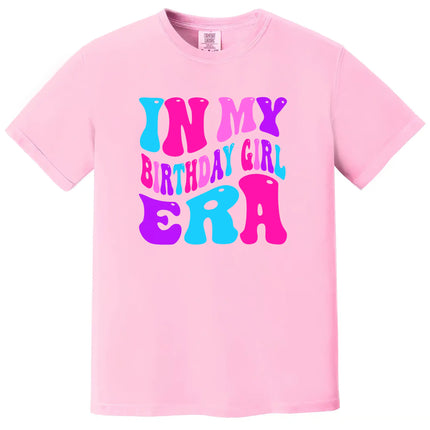 In My Birthday Girl Era women’s birthday tee in pink, retro multicolor lettering in pink, purple, and blue, playful and bold graphic birthday shirt