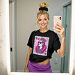 Model wearing black “Birthday Queen” t-shirt in casual lifestyle setting, showcasing modern queen of hearts design with crown, jewels, and sunglasses for birthday celebration