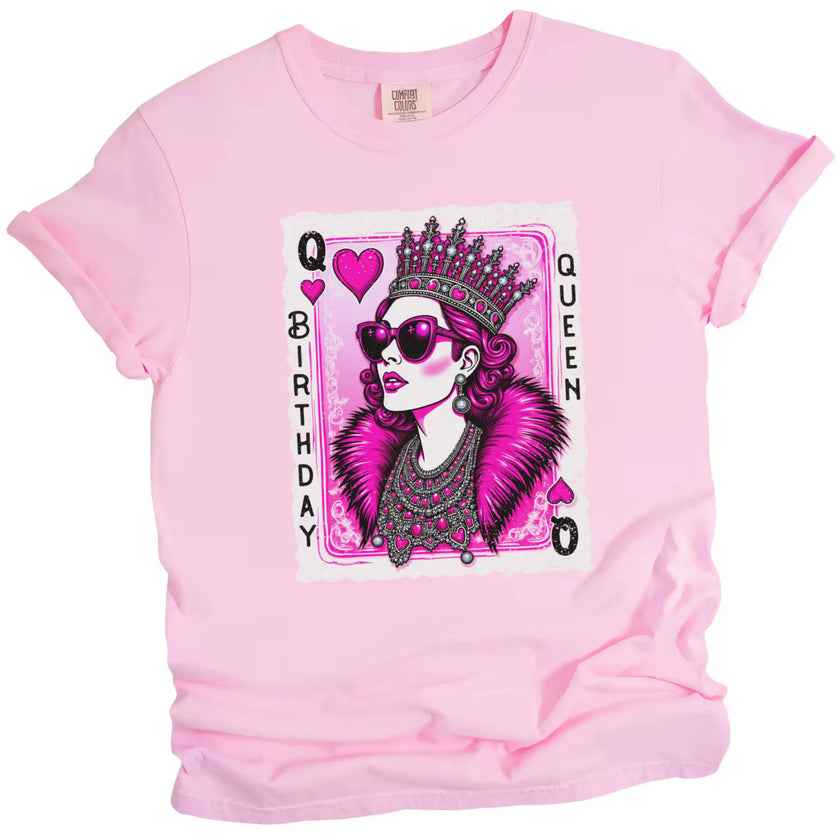 Pink “Birthday Queen” t-shirt flat lay with glamorous queen of hearts design, diamond crown, jewels, and sunglasses, perfect for birthday parties