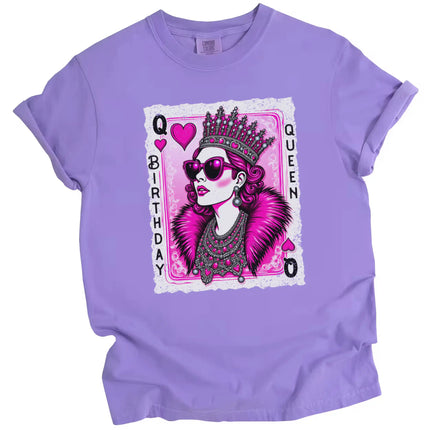 Purple “Birthday Queen” t-shirt flat lay with sparkling crown, jewel accents, and sunglasses on queen of hearts illustration for birthday vibes