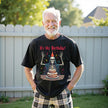 Model wearing black “It’s My Birthday” skeleton t-shirt celebrating birthday in a casual lifestyle setting with confetti and playful vibes