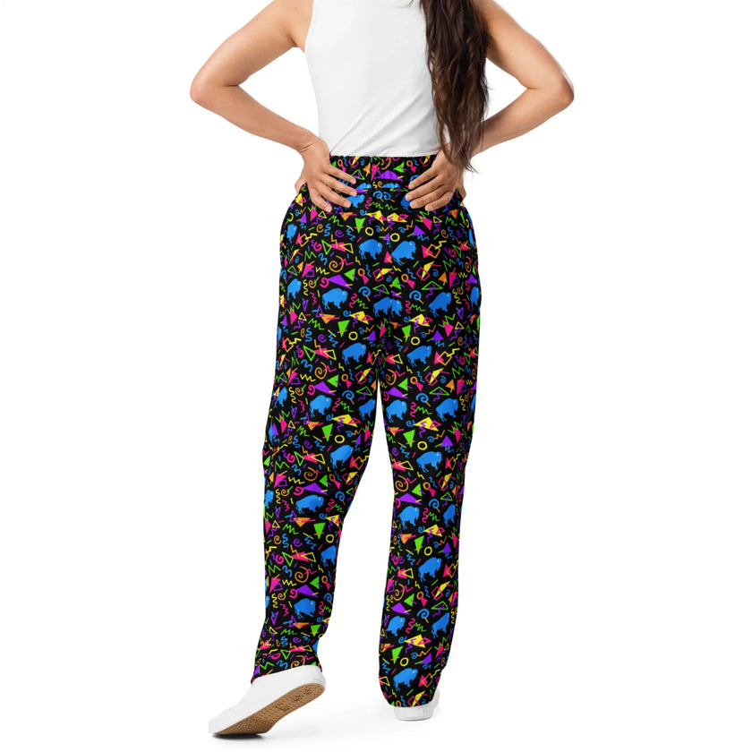 Unisex Buffalo retro pants featuring bold neon geometric pattern with colorful 80s inspired shapes and blue buffalo silhouettes, statement apparel for Buffalo fans.