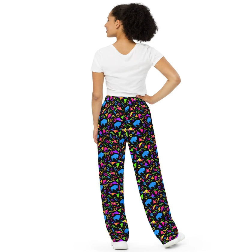 Unisex Buffalo retro pants featuring bold neon geometric pattern with colorful 80s inspired shapes and blue buffalo silhouettes, statement apparel for Buffalo fans.