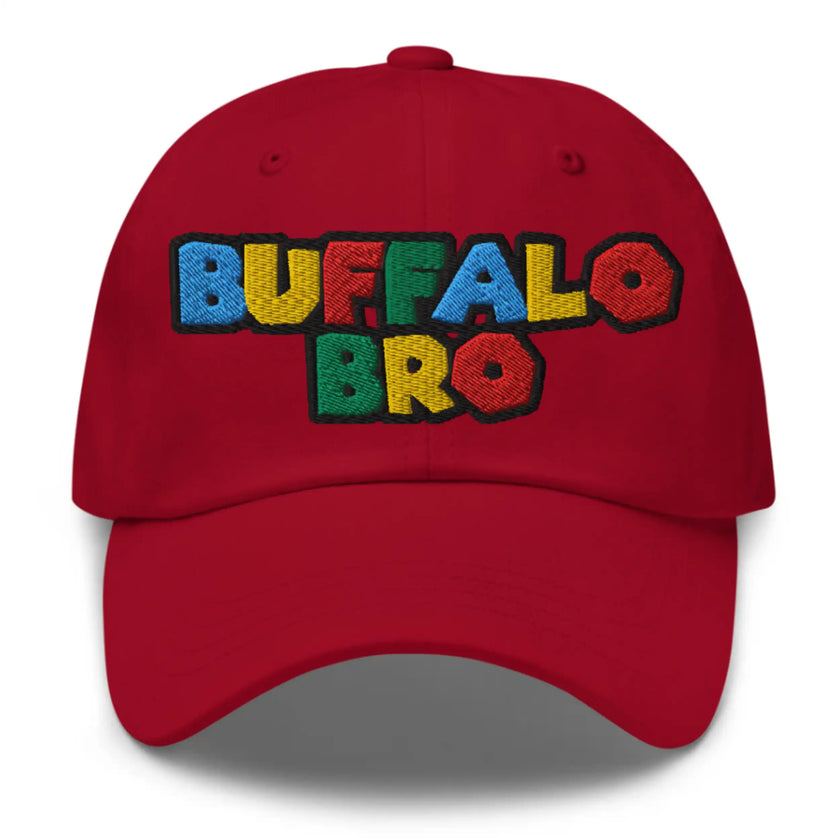 Red dad hat featuring Super Buffalo Bro retro video game inspired embroidery with nostalgic 90s color styling, Buffalo streetwear cap design.