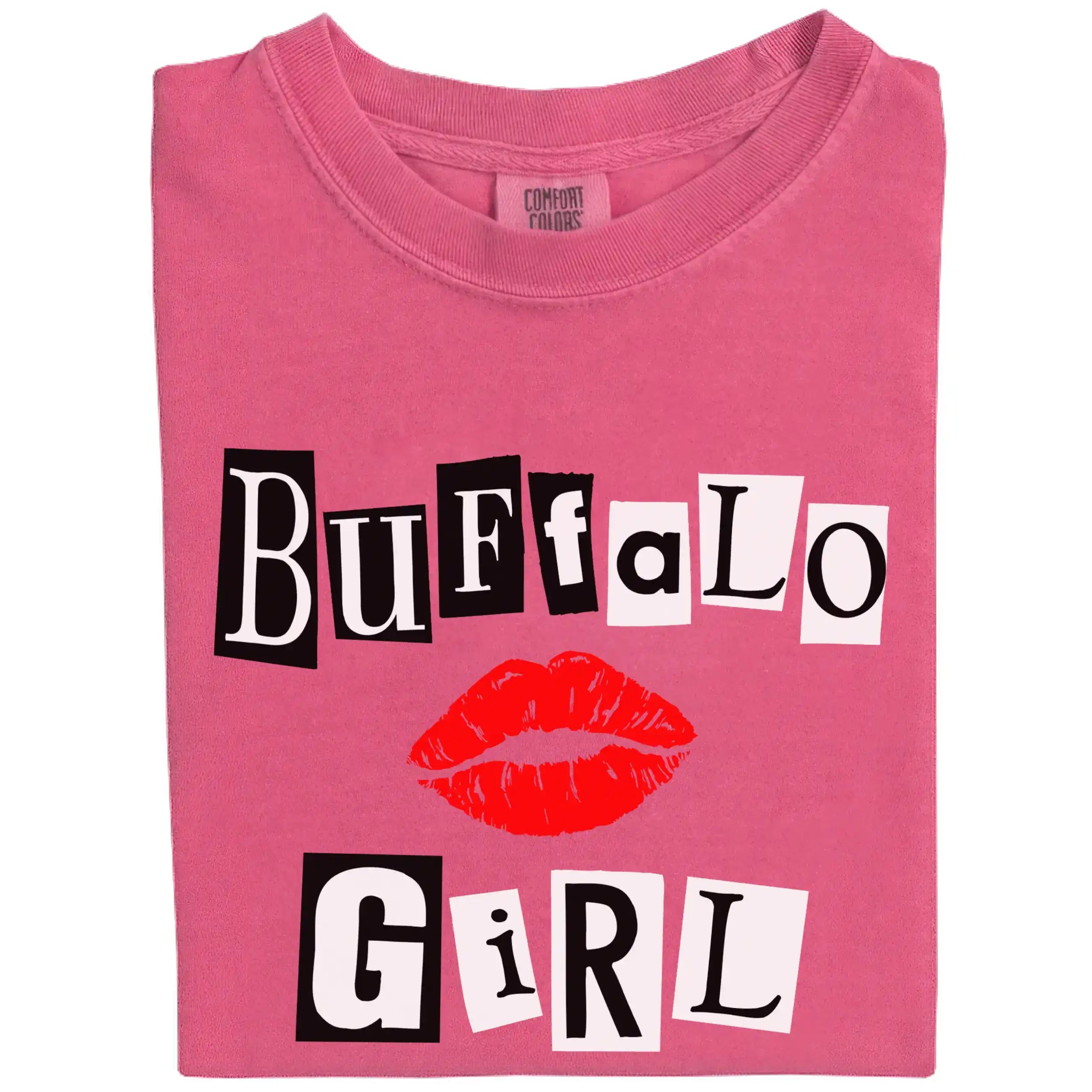 Folded berry pink Buffalo Girl tee with black and white magazine-style lettering, showcasing city pride and edgy style.