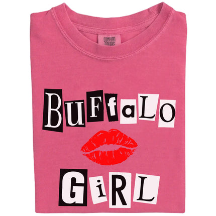 Folded berry pink Buffalo Girl tee with black and white magazine-style lettering, showcasing city pride and edgy style.