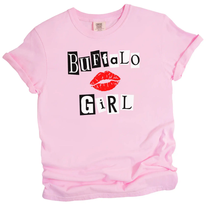 Light pink Buffalo Girl t-shirt featuring bold magazine-style lettering with pop-culture attitude, flat lay on white background.