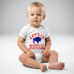 Baby wearing heather grey Let’s Go Buffalo bodysuit with distressed red lettering and blue buffalo silhouette for Buffalo football family outfits