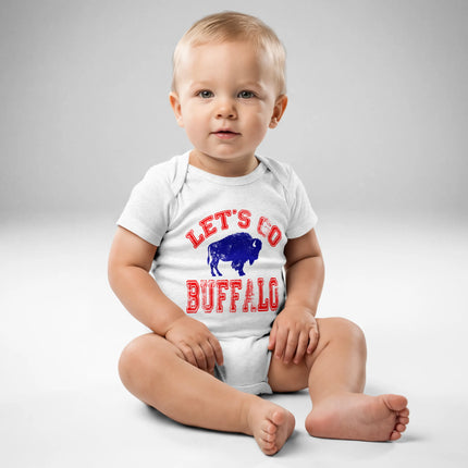 Baby wearing heather grey Let’s Go Buffalo bodysuit with distressed red lettering and blue buffalo silhouette for Buffalo football family outfits
