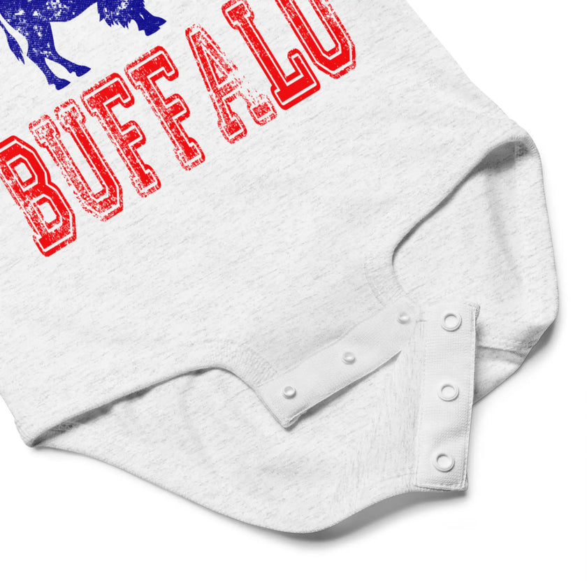 Close-up of grey Let's Go Buffalo football baby bodysuit snap closure detail for easy diaper access and soft cotton baby apparel design.