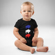 Baby wearing black Buffalo football baby bodysuit featuring vertical blue white and red buffalo silhouette design, front view game day outfit.