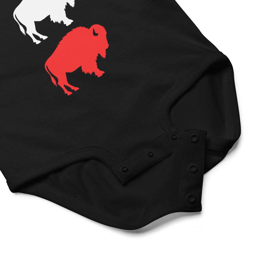 Close-up of black Buffalo football baby bodysuit snap closure detail for easy diaper changes and soft cotton baby outfit design.