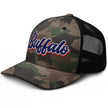 Left side view of Buffalo Football camouflage trucker hat highlighting the detailed camo pattern and retro red white and blue embroidered design