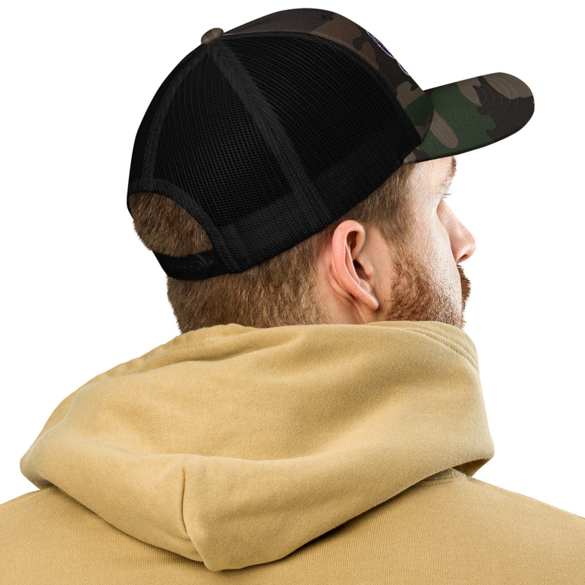 Man viewed from behind wearing a Buffalo Football camo trucker hat showcasing the breathable mesh back, adjustable fit, and classic casual style.