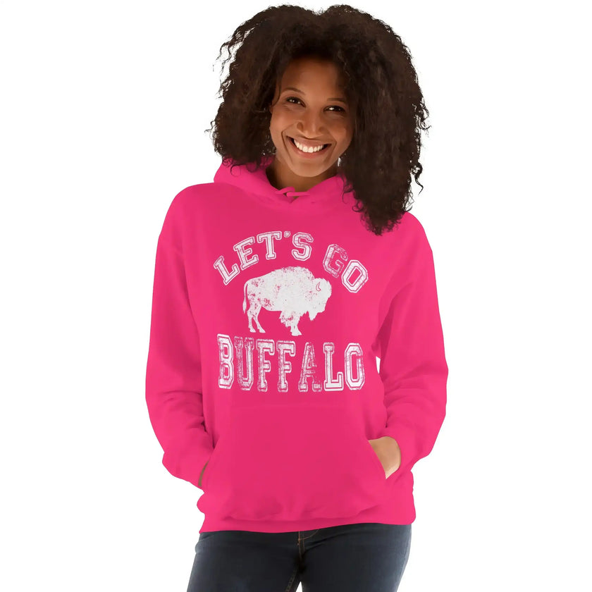 Hot pink Let’s Go Buffalo women’s hoodie with bold white lettering and buffalo football graphic. Perfect fan style for women.