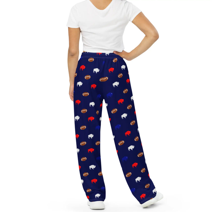 Back view of navy wide leg lounge pants featuring all-over Buffalo football print with colorful buffalo silhouettes and repeating brown football design.
