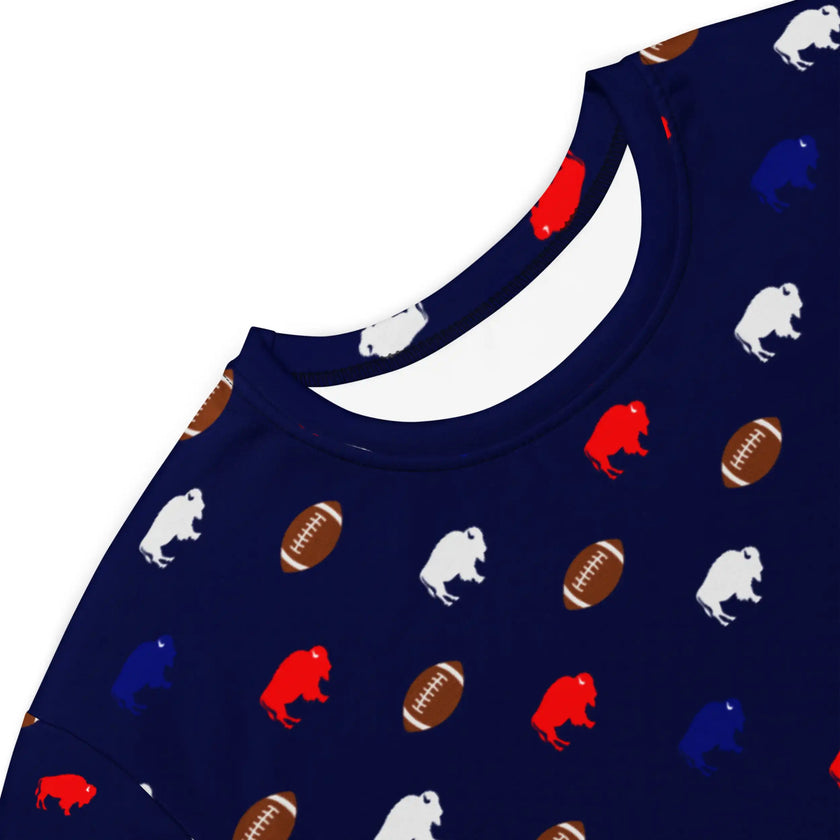 Close-up of Buffalo football loungewear dress showing detailed all-over print with repeating red blue white buffaloes and brown footballs on soft fabric.