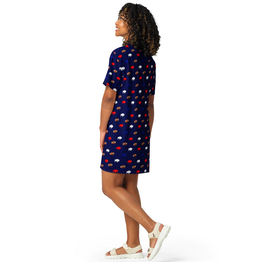 Side view of woman in Buffalo football loungewear dress featuring playful all-over print of red blue white buffaloes and brown footballs in oversized relaxed fit.
