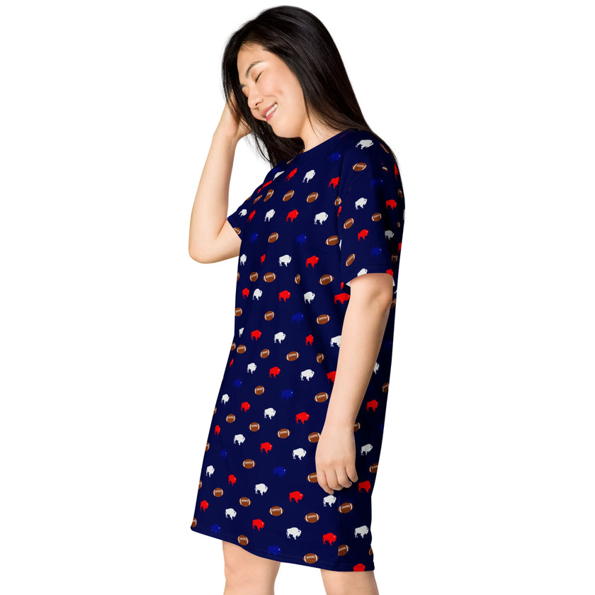 Left side view of woman wearing Buffalo football lounge dress with feminine repeating buffalo and football pattern in red blue white and brown all-over print design.