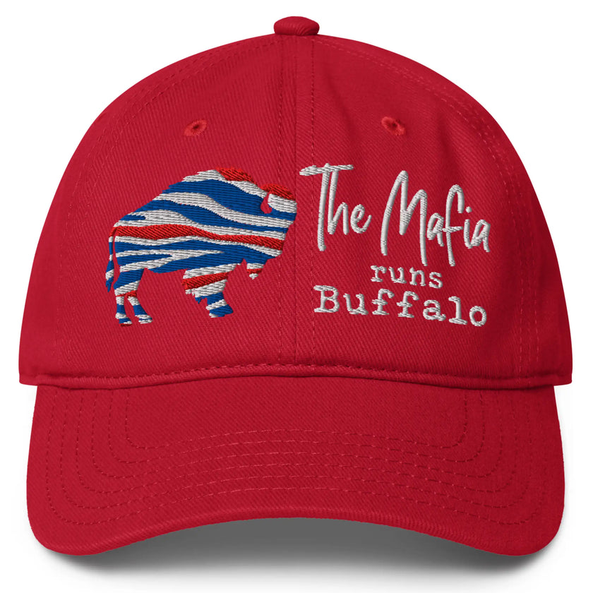 Red Buffalo football Mafia hat featuring red white and blue striped buffalo silhouette, ‘The Mafia Runs Buffalo’ embroidery in fancy and typewriter fonts, bold Buffalo football fan apparel.