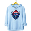 Buffalo football graphic hoodie in light blue, blue buffalo mascot wearing striped team color sunglasses and puffball Buffalo beanie.