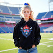Female model wearing black Buffalo football hoodie featuring blue buffalo mascot with red white blue striped sunglasses and Buffalo winter beanie.