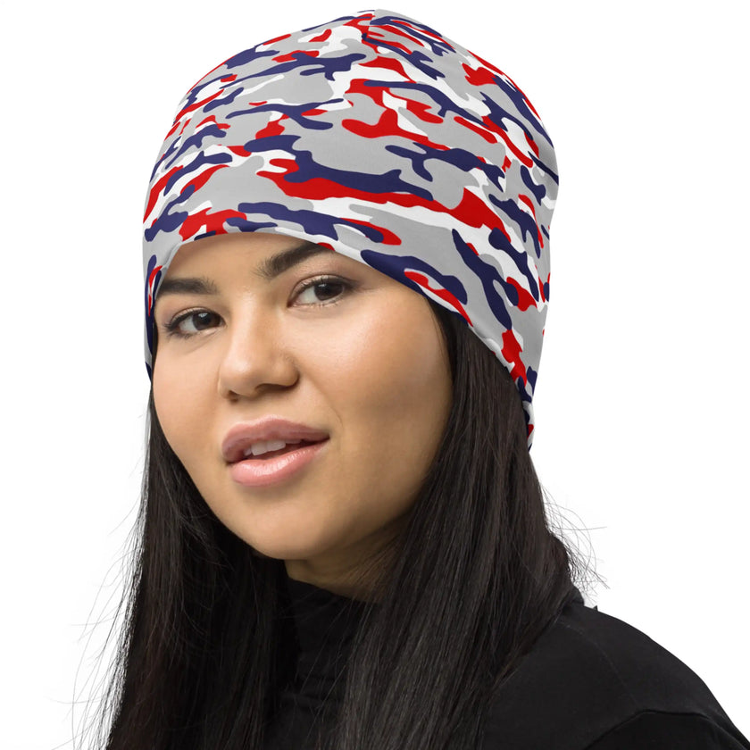 Woman wearing a Buffalo football camouflage beanie viewed from the left, showcasing the cozy knit texture and bold outdoor-inspired fan style.