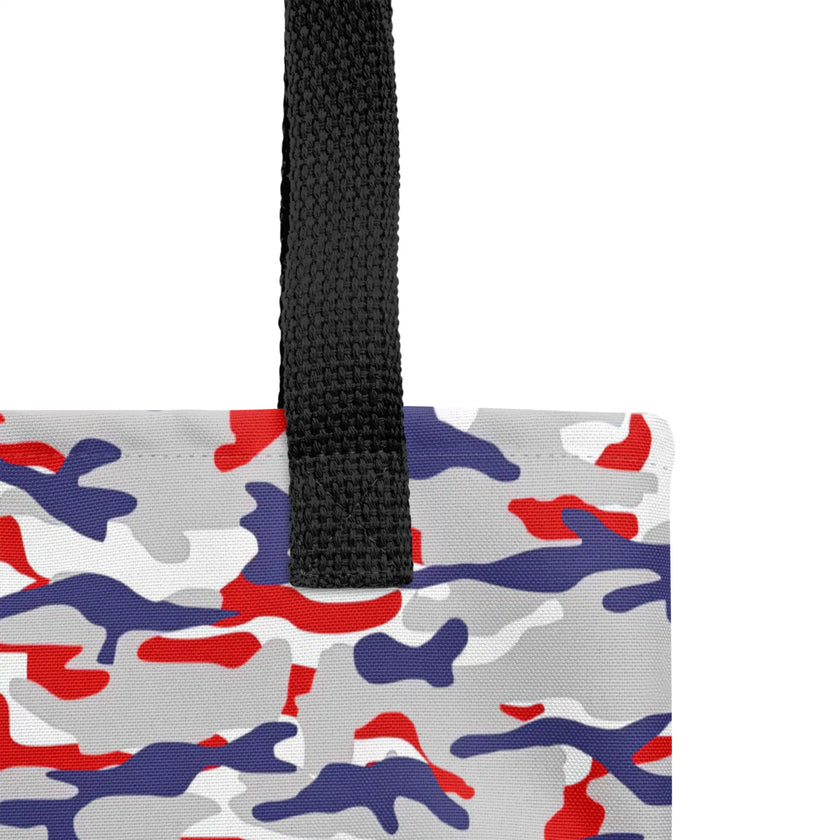 Close-up view of the tote bag handles alongside the original Buffalo football camouflage pattern in bold red white blue and grey colors.